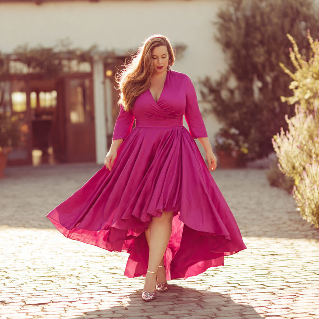25 Best Plus Size Wedding Outfit Ideas: Stunning Styles for Every Celebration 11 Vibrant Fuchsia High Low Hemline